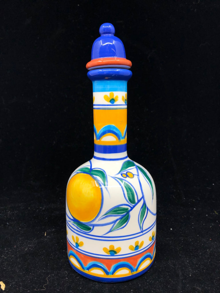 YELLOW AND BLUE OIL EMPTY DECANTER.