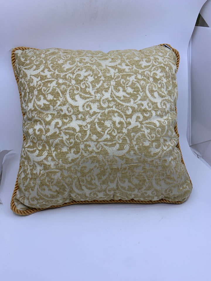 TAN SCROLL PILLOW.