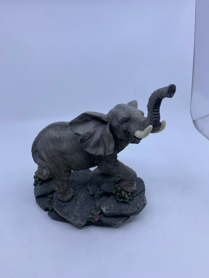 ELEPHANT ON ROCKS.