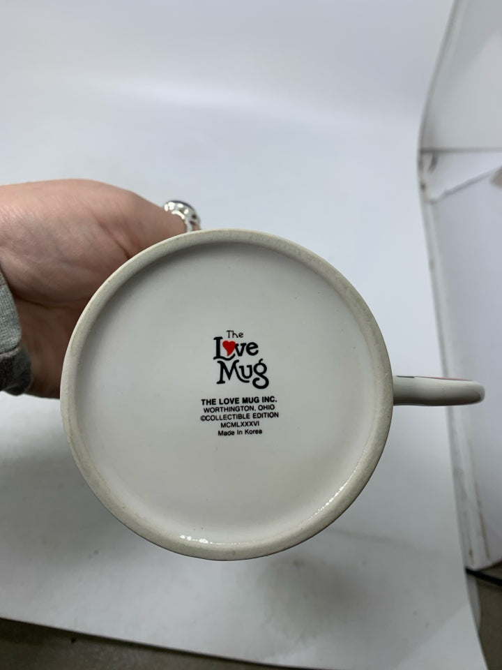 WHITE MUG W/ NUTCRACKER HANDLE "SEASON GREETINGS".
