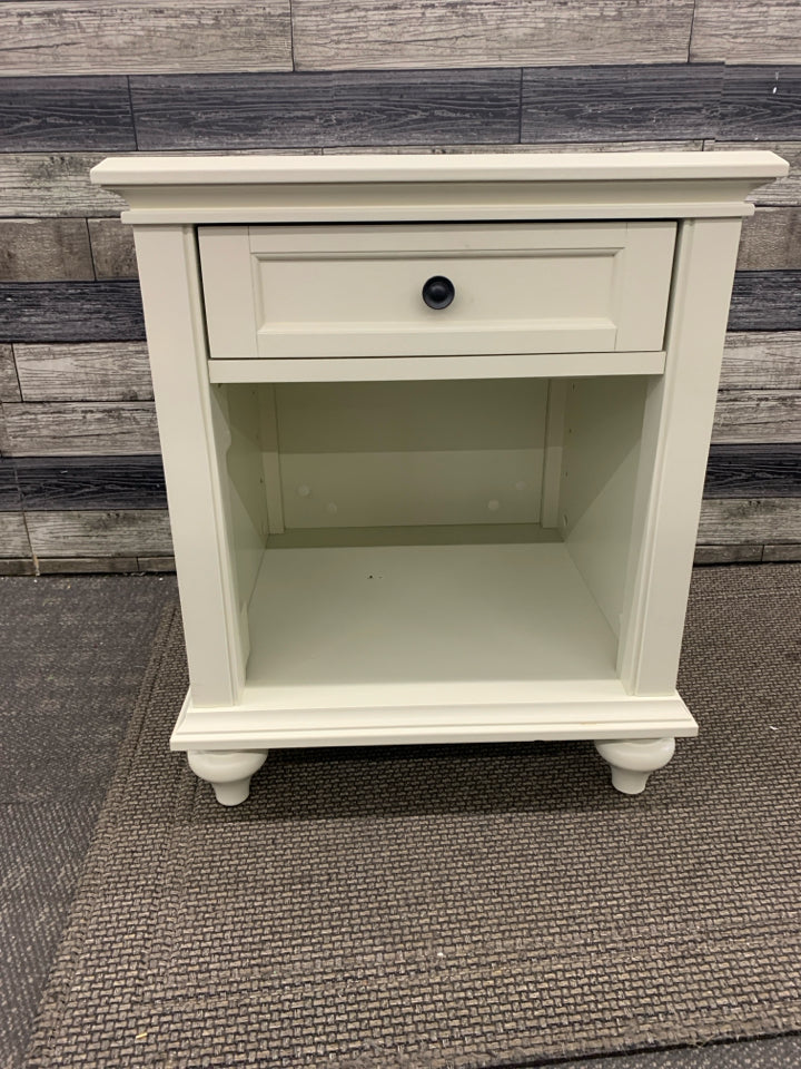 WHITE NIGHT STAND W/ DRAWER BLACK HARDWARE.