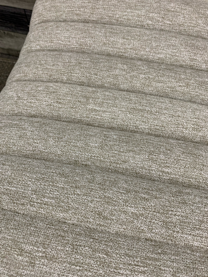 GREY TUFTED CURVED FOOTSTOOL.