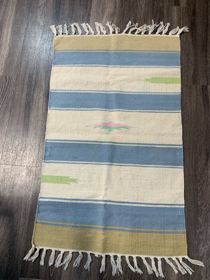 ASSORTED COLORS WOVEN AZTEC PATTERN RUG W/ TASSELS.