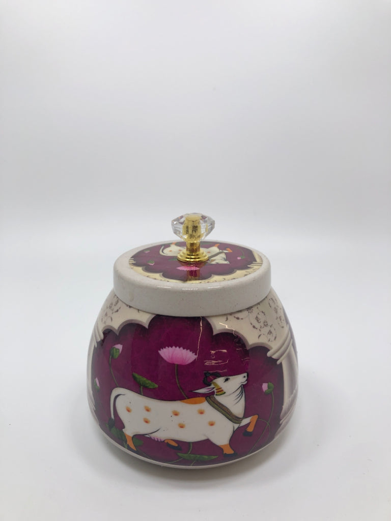 WHITE METAL JAR W/COW PRINT AND LID.