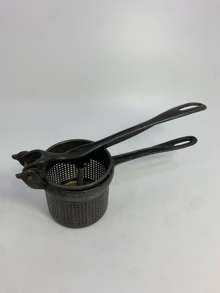 VTG CAST IRON POTATO RICER.