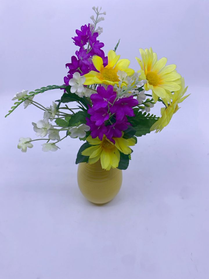 YELLOW AND PURPLE FAUX FLORAL IN YELLOW VASE.