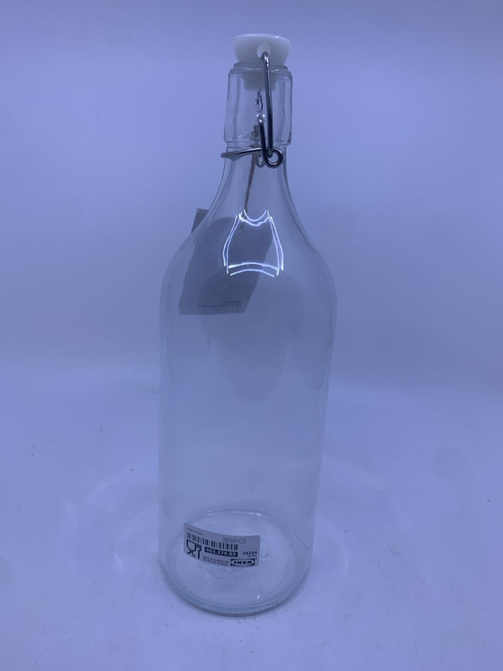 GLASS BOTTLE W/ CLASP AND STOPPER.