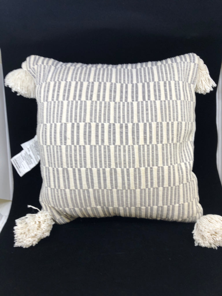 GREY STRIPE PILLOW W/CREAM TASSLES.