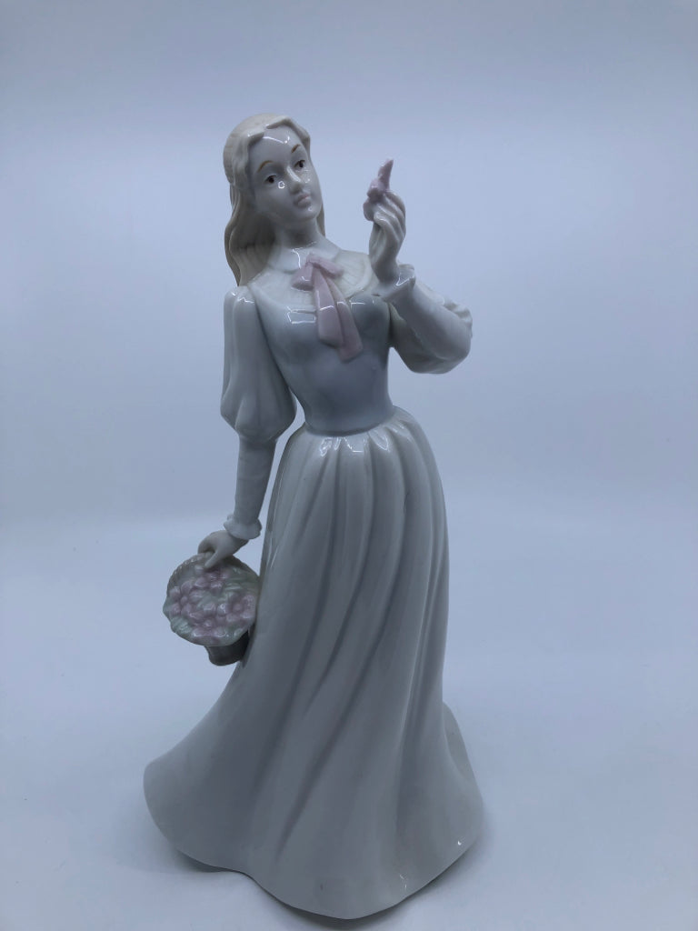 LADY W/BASKET OF FLOWERS PORCELAIN FIGURINE.