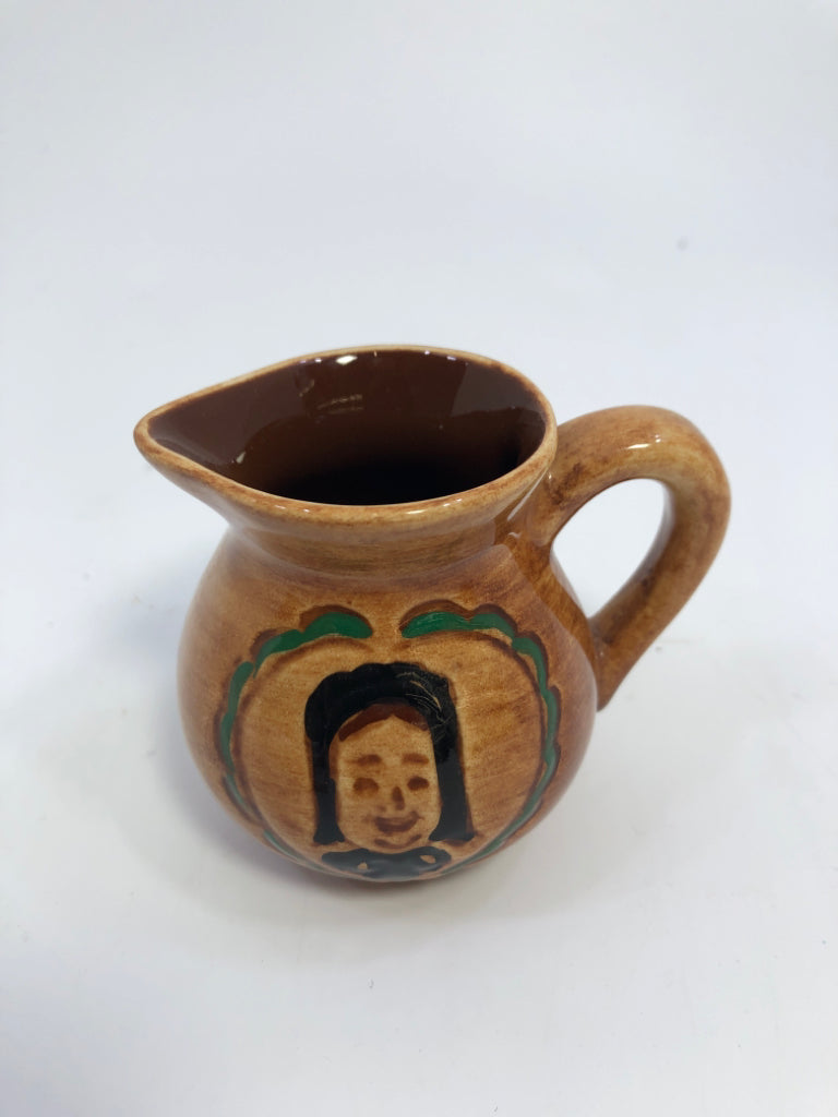 MINI BROWN PITCHER W/PAINTED WOMAN.