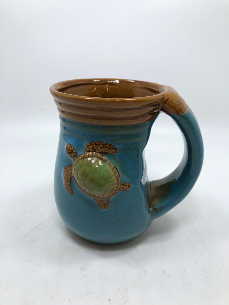 TEAL GLAZED COFFE MUG W/TURTLE.