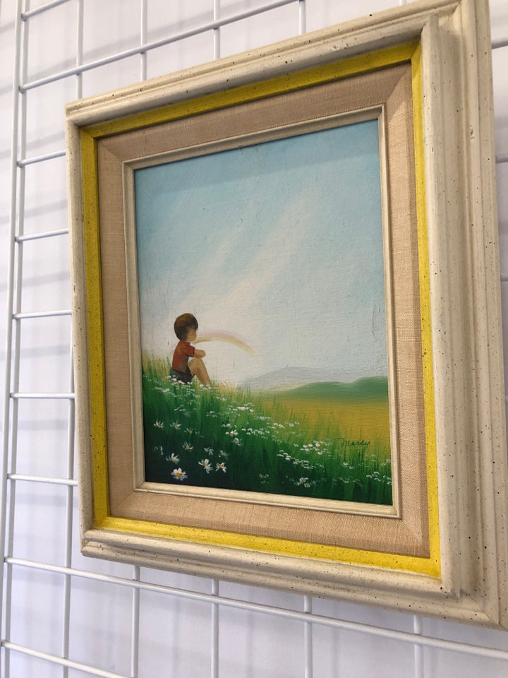 VTG BOY SITTING IN FIELD WALL ART IN THICK WOOD FRAME.