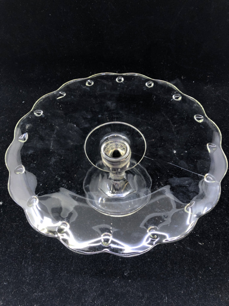 FOOTED GLASS CAKE STAND W DOT PATTERN AND WAVY EDGES.