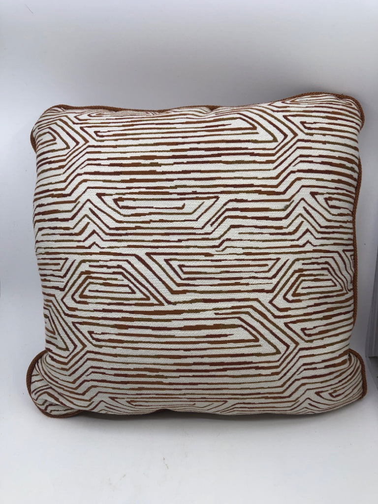 ORANGE AND CREAM ZIGZAG PILLOW.