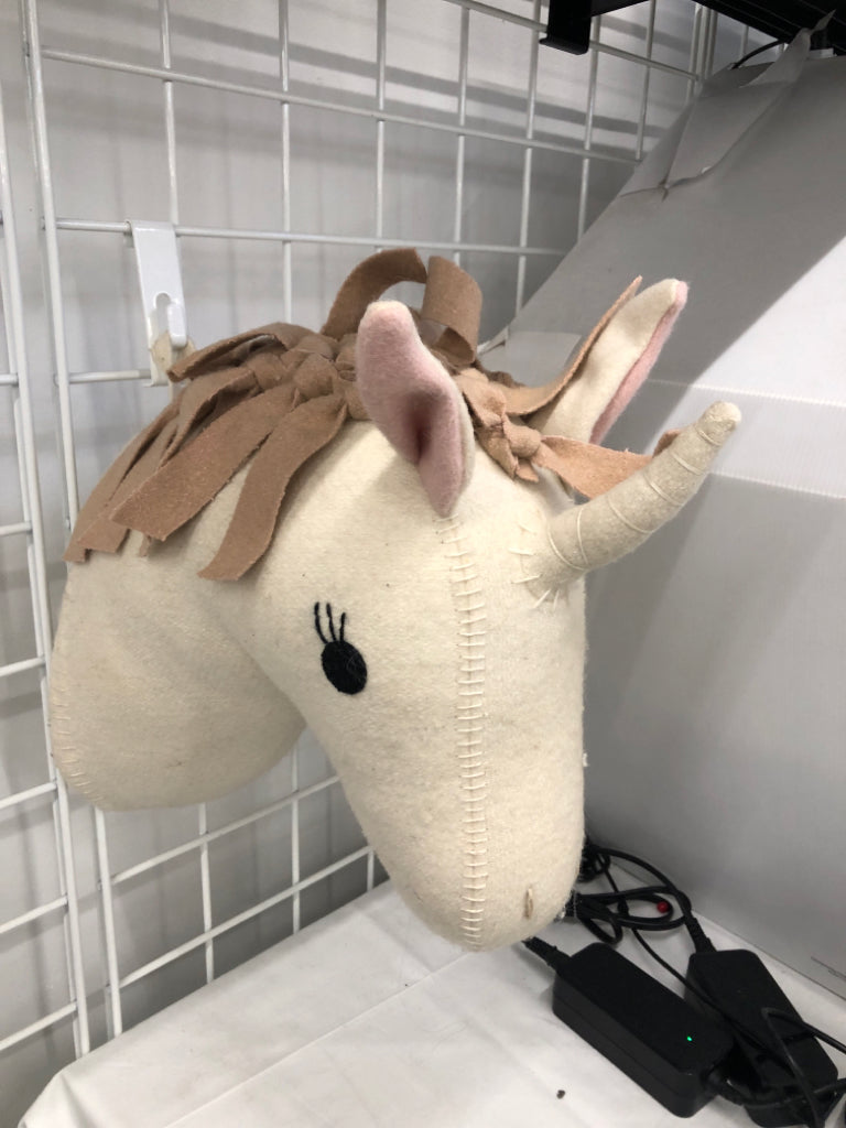 PLUSH UNICORN WALL HANGING.