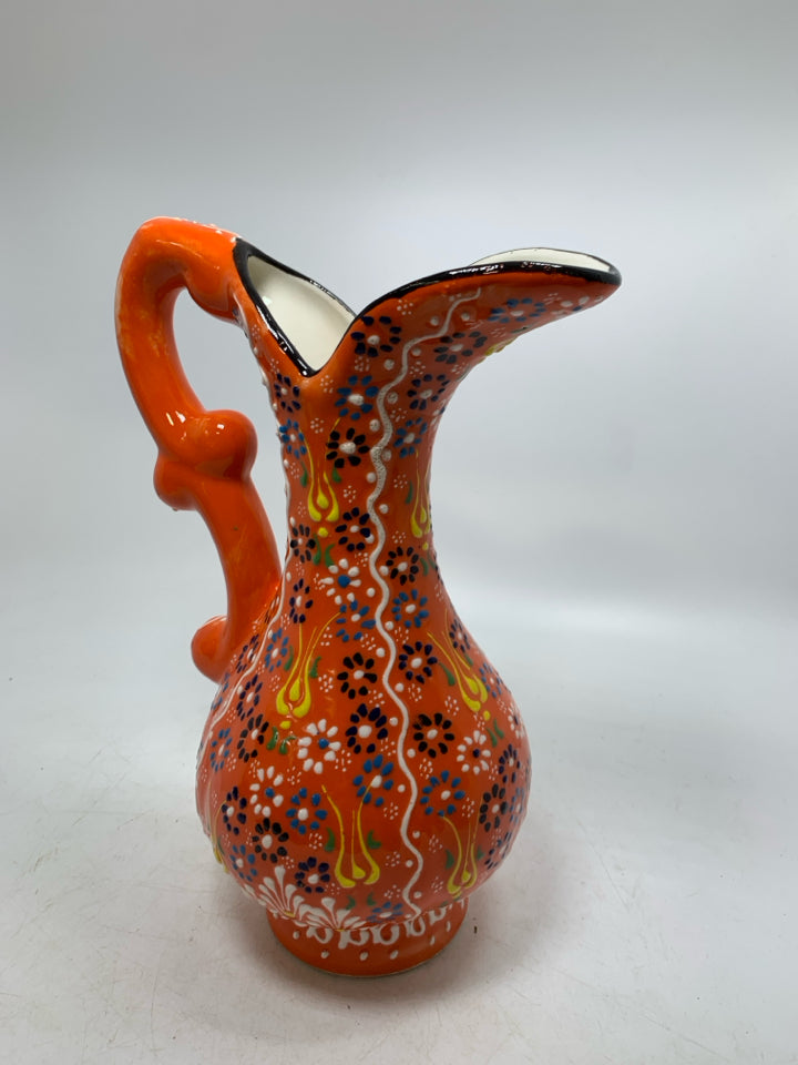 FOOTED EMBOSSED COLORFUL PITCHER.