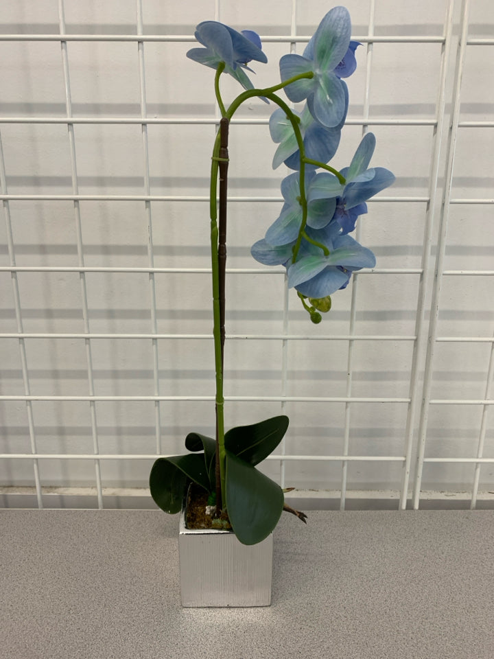 FAUX BLUE ORCHID IN SILVER POT.