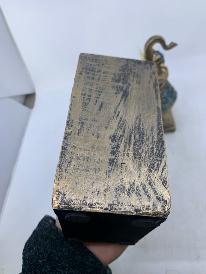 RESIN ELEPHANTS PAINTED GOLD W/ BLUE DETAILS.