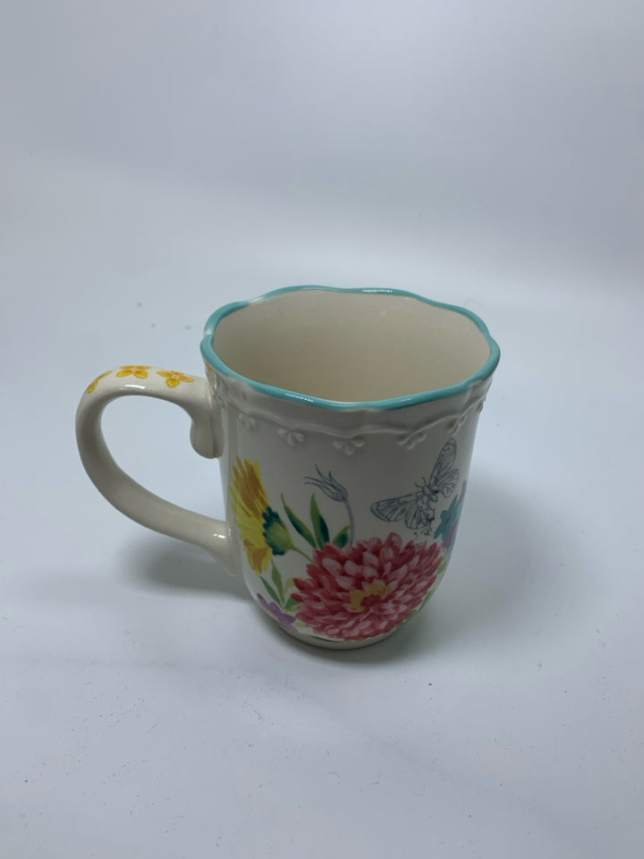 FLORAL MUG W/ BLUE SCALLOP EDGE.
