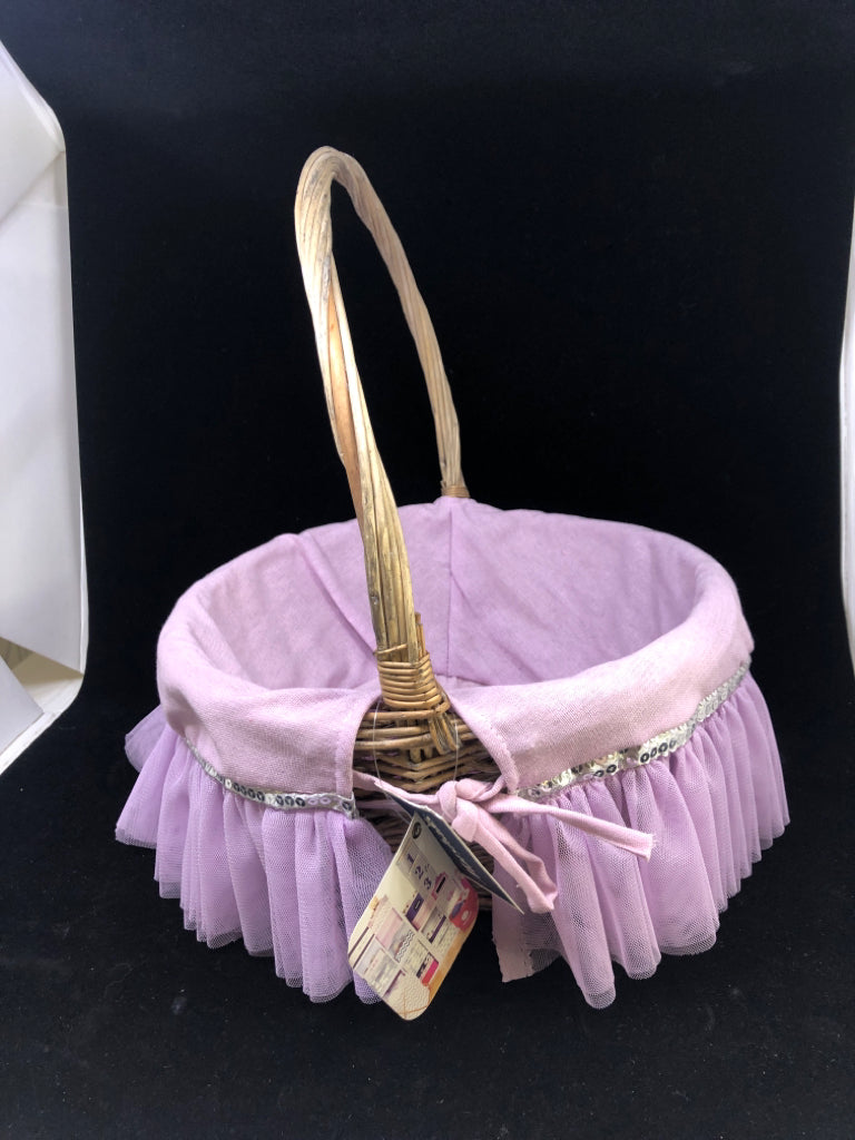 WICKER BASKET W/PURPLE TULLE CLOTH.