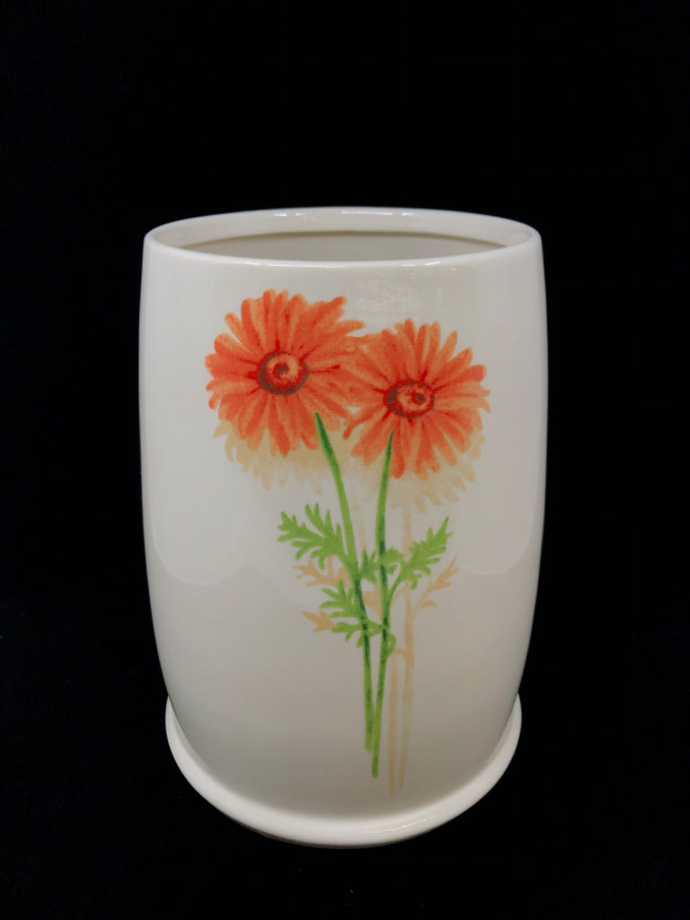 BEIGE BOTANICAL CERAMIC WASTE BASKET.