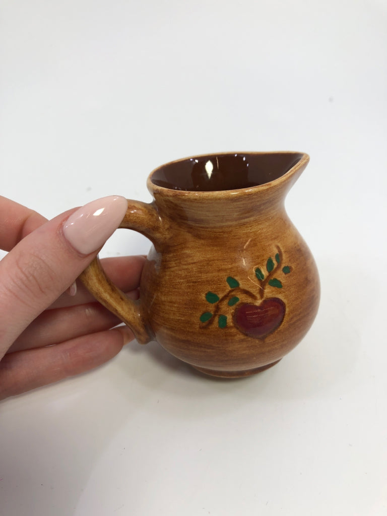 MINI BROWN PITCHER W/PAINTED WOMAN.