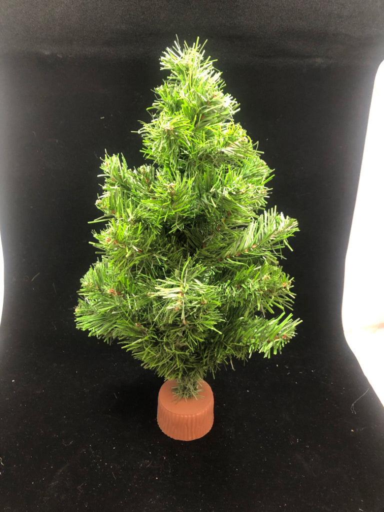 TABLETOP ARTIFICIAL PINE TREE ON BROWN BLOCK.