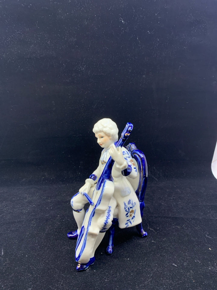 VTG BLUE AND WHITE VICTORIAN MAN PLAYING CELLO.