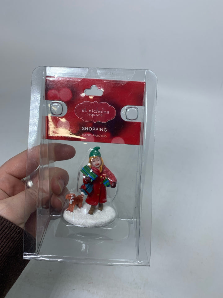 NIP GIRL HOLDING PRESENT W/ DOG VILLAGE CHARACTER.