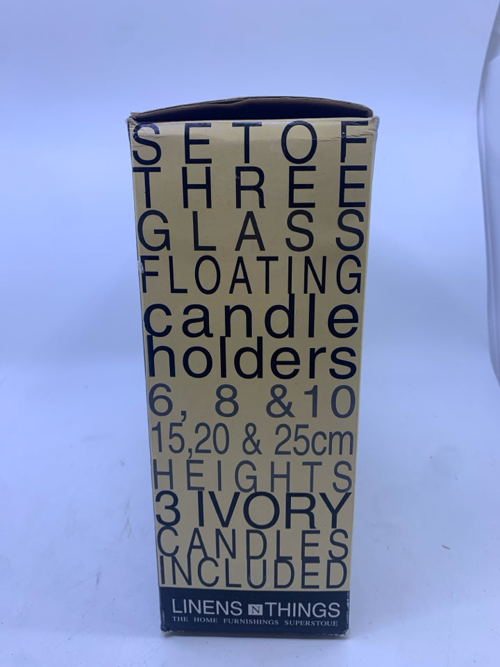 NIB FLOATING CANDLE HOLDERS.