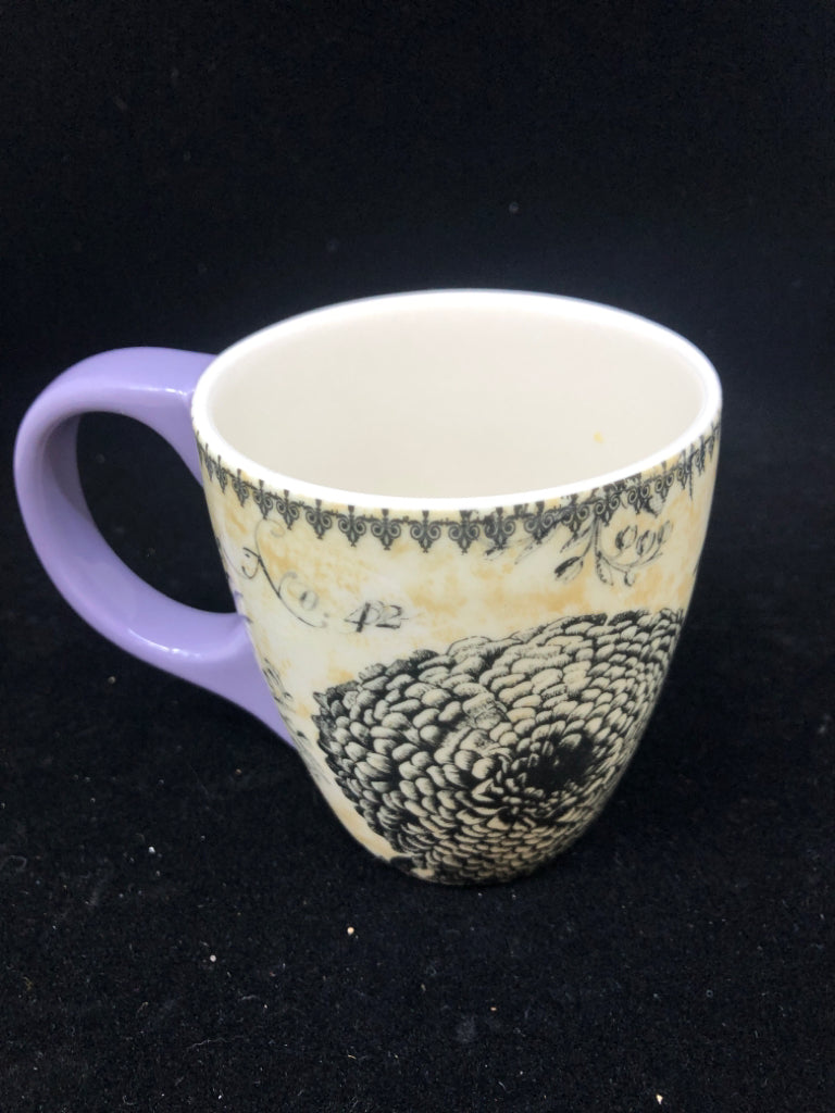 FLORAL MUG W PURPLE HANDLE.