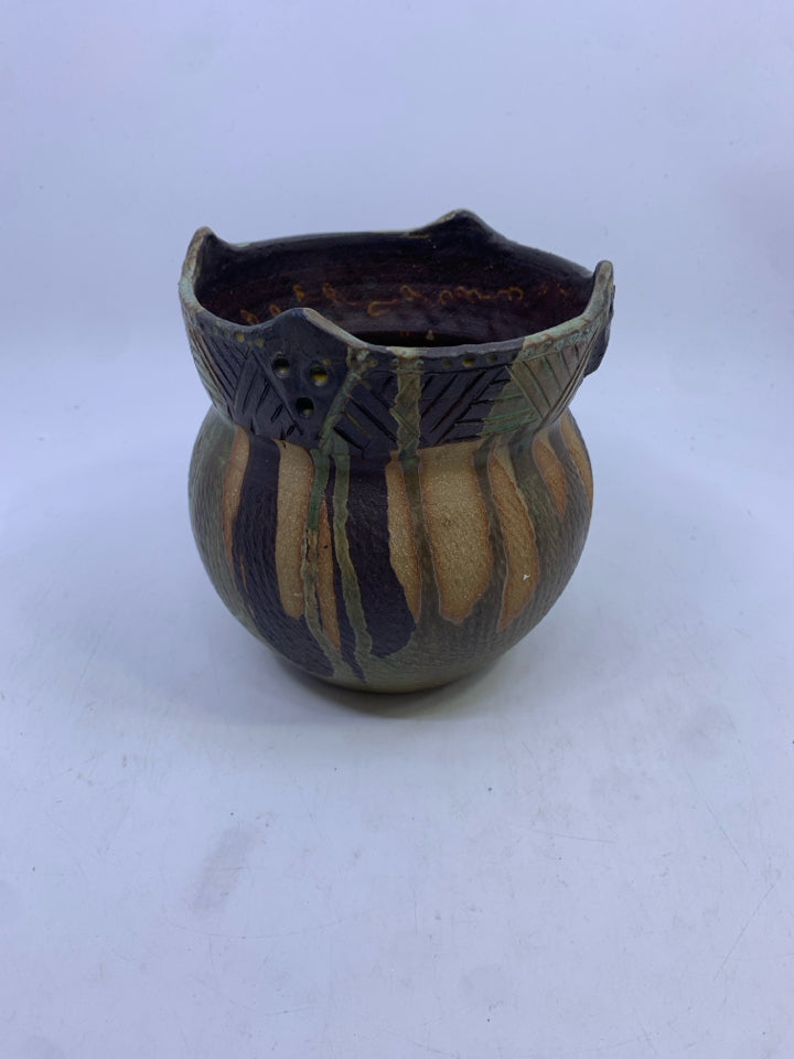 GREEN AND BROWN CARVED POTTERY VASE.