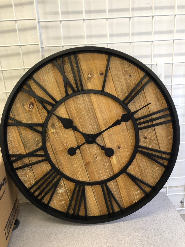LARGE WOOD CLOCK W/ROMAN NUMERALS & BLACK BORDER.