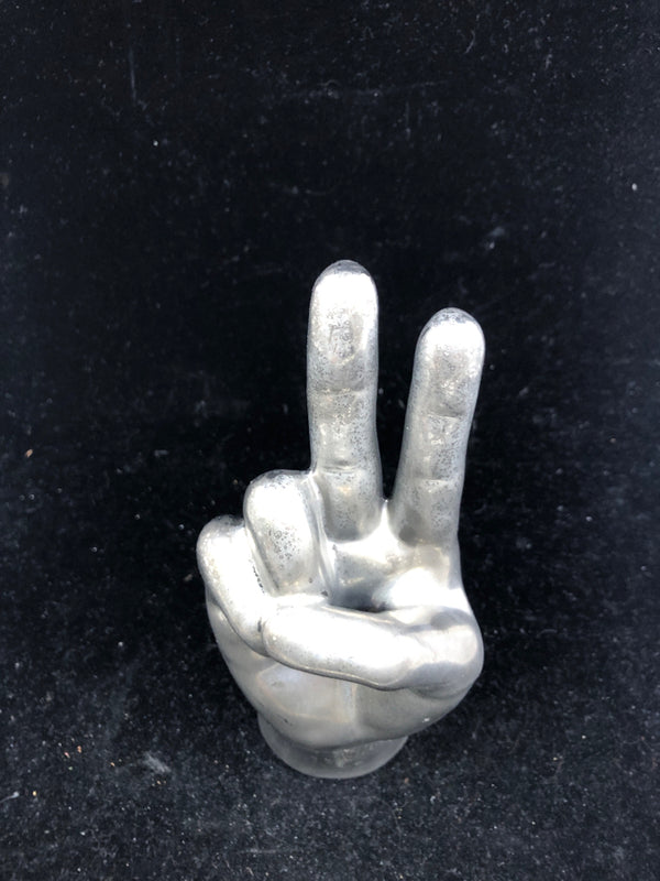 SILVER STANDING HAND FIGURE WITH PEACE SIGN.