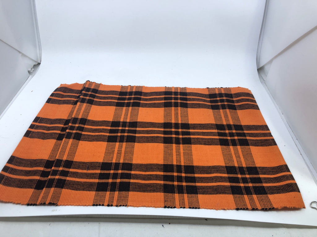 4 BLACK AND ORANGE PLAID PLACEMATS.