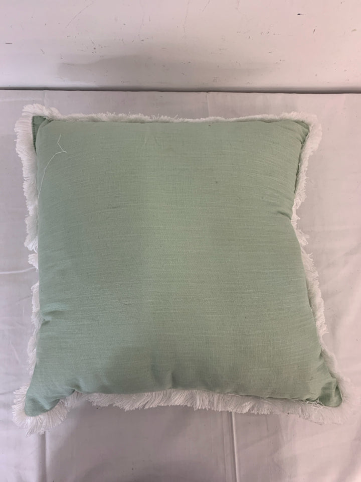 TEAL PILLOW W/ WHITE FRINGE BORDER.