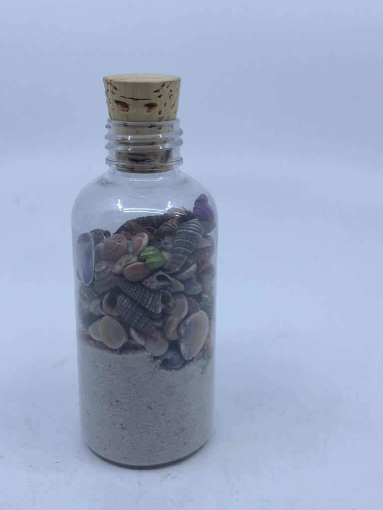 JAR OF SAND W SHELLS.