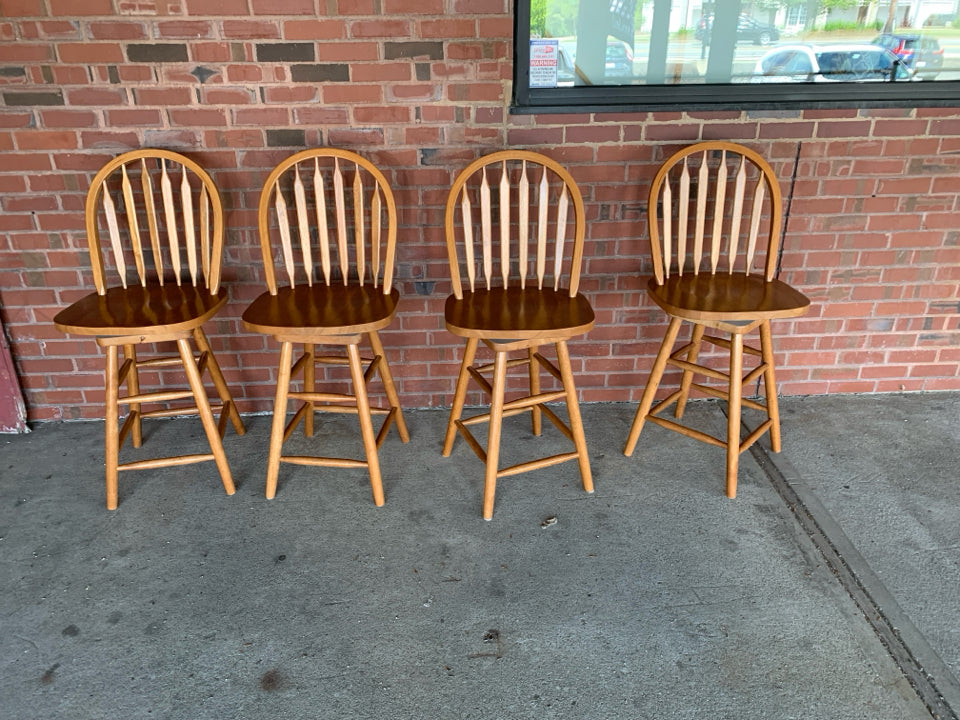 4 BLONDE WOOD SWIVEL BAR STOOLS.
