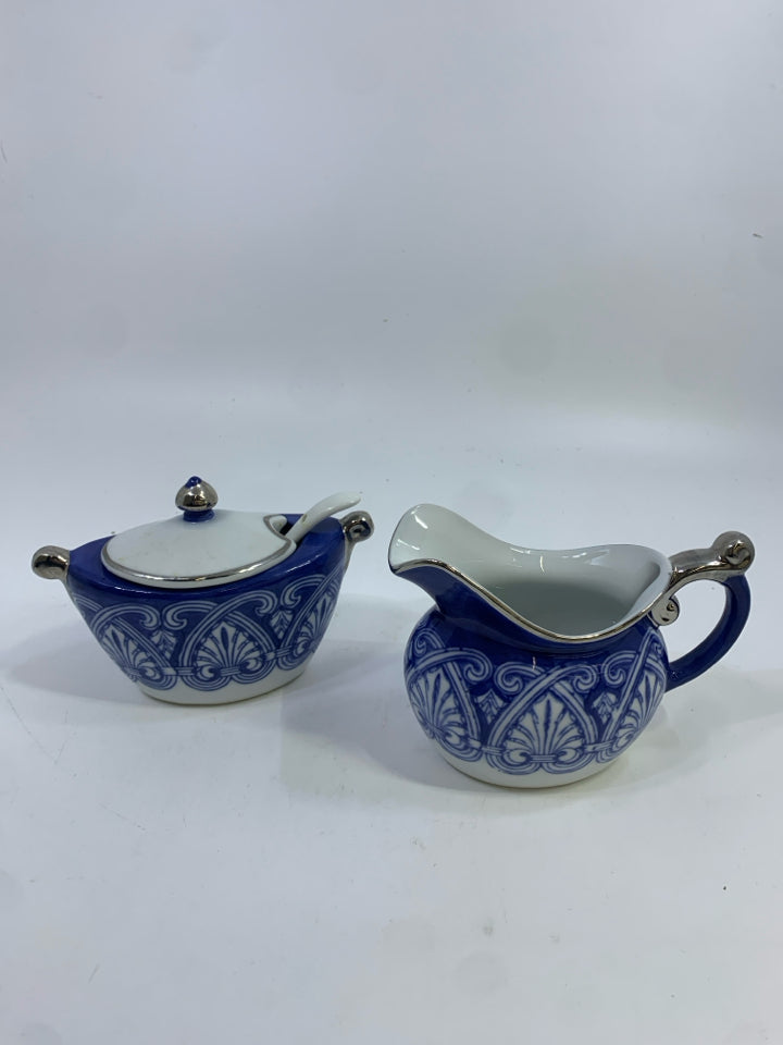 PORCELAIN SUGAR AND CREAMER BLUE W/SILVER TRIM.