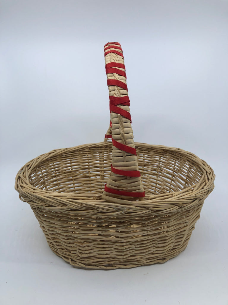 BLONDE WICKER BASKET W/HANDLE AND RED RIBBON.