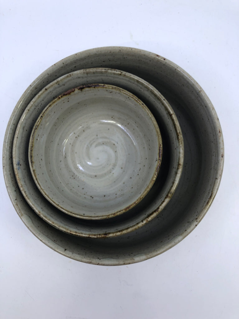 3 GREY POTTERY W FLORAL NESTING BOWLS.