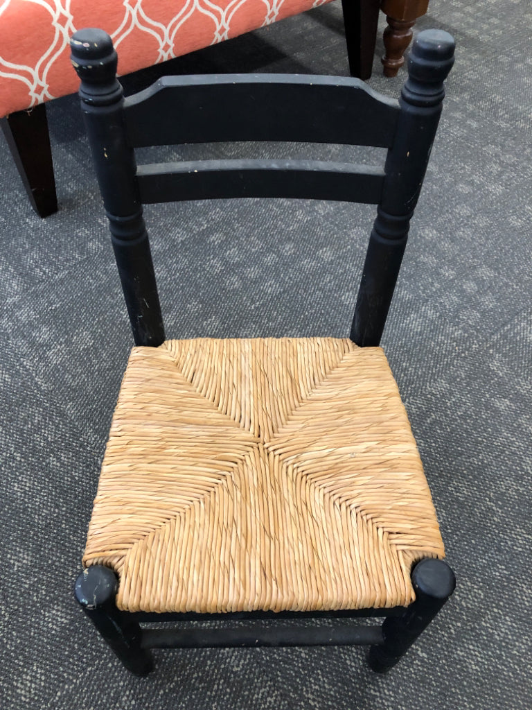 KIDS BLACK TABLE W/2 WICKER CHAIRS.