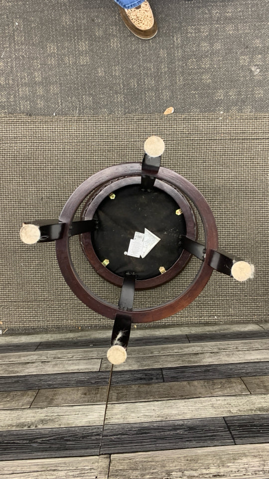 DARK WOOD ROUND STOOL W FAUX LEATHER SEAT.