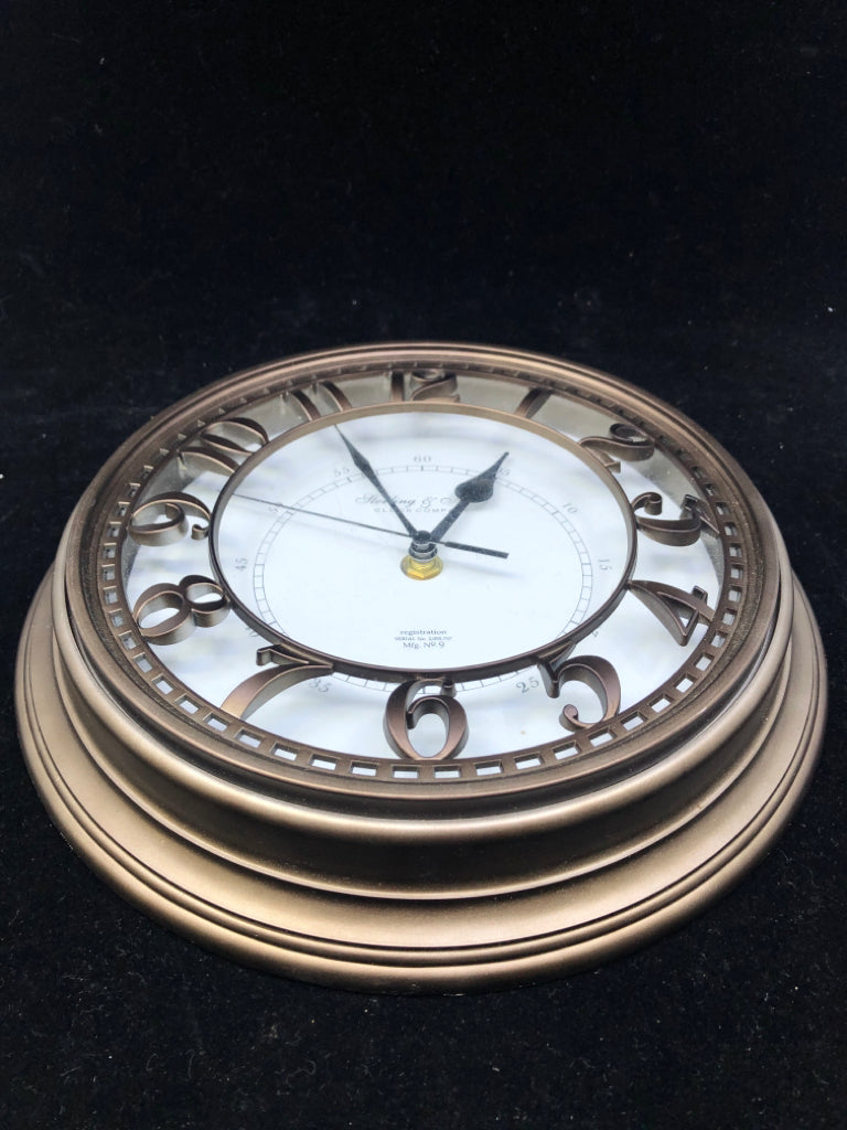 SMALL STERLING & NOBLE BRONZE COLORED CLOCK.