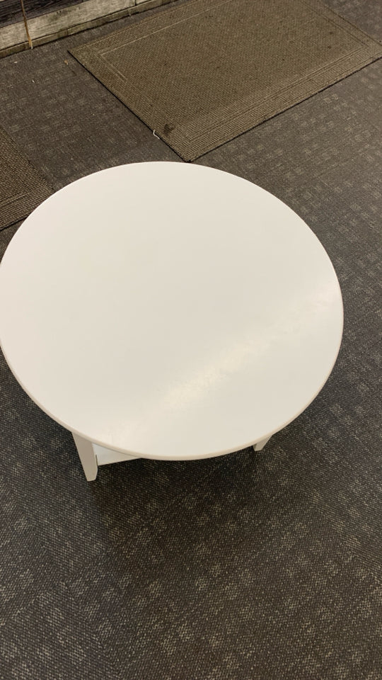 3-TIER WHITE CIRCLE TABLE.