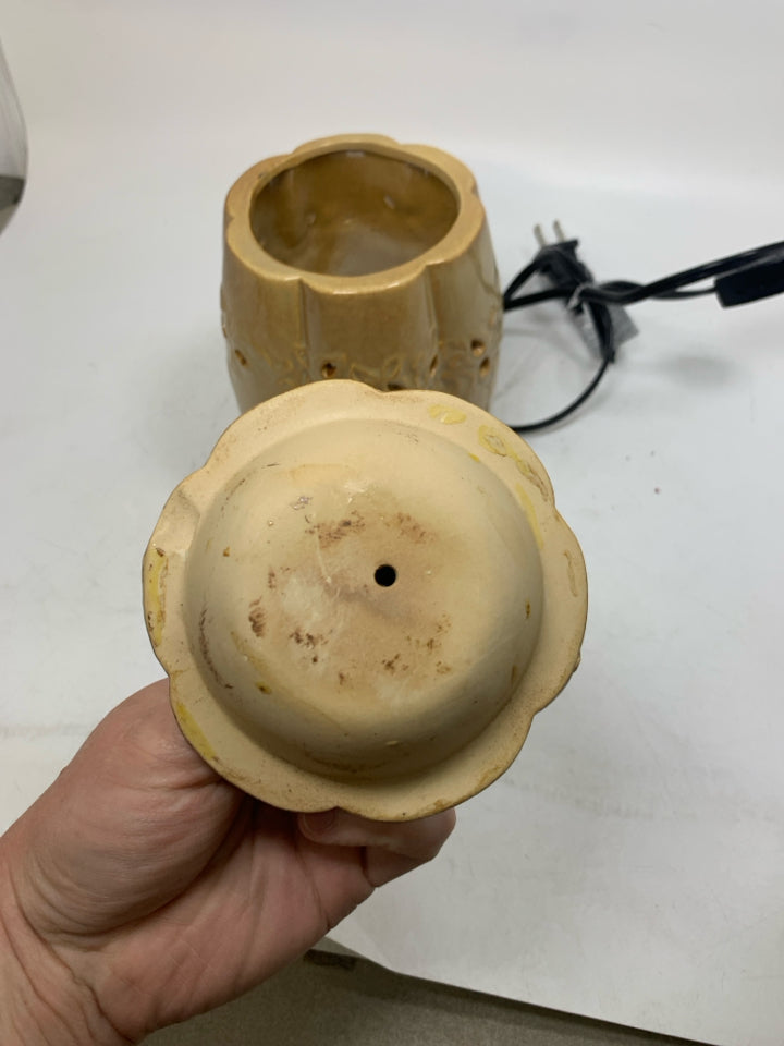 TAN PUMPKIN SHAPED PIERCED TART WARMER.