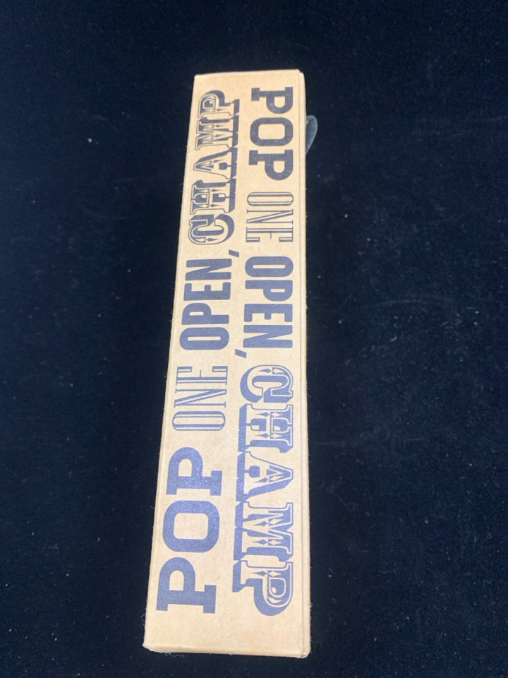 NIB WORLD CHAMPION BOTTLE OPENER.