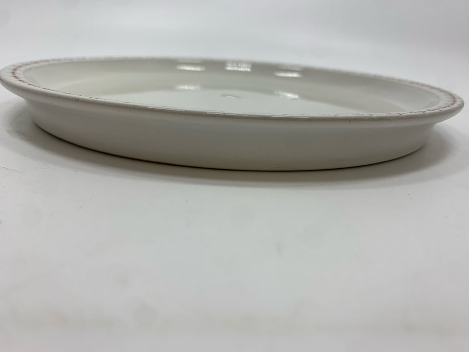 4 WHITE STONEWARE PLATES W/RED DOTTED RIM.