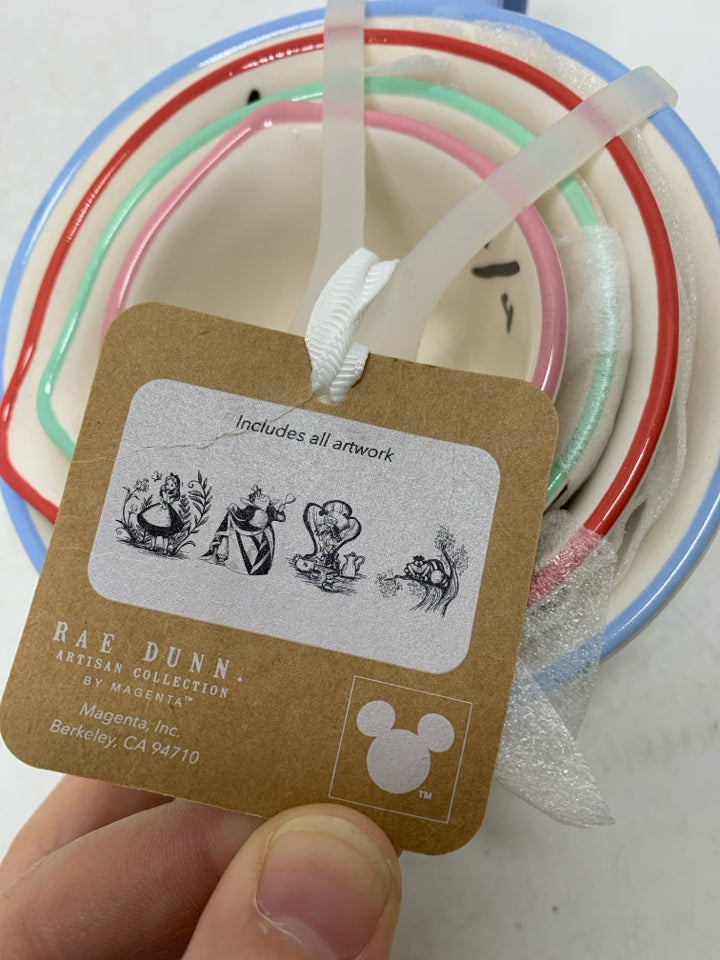 NIP 4 ALICE IN WONDERLAND MEASURING CUPS NESTING.