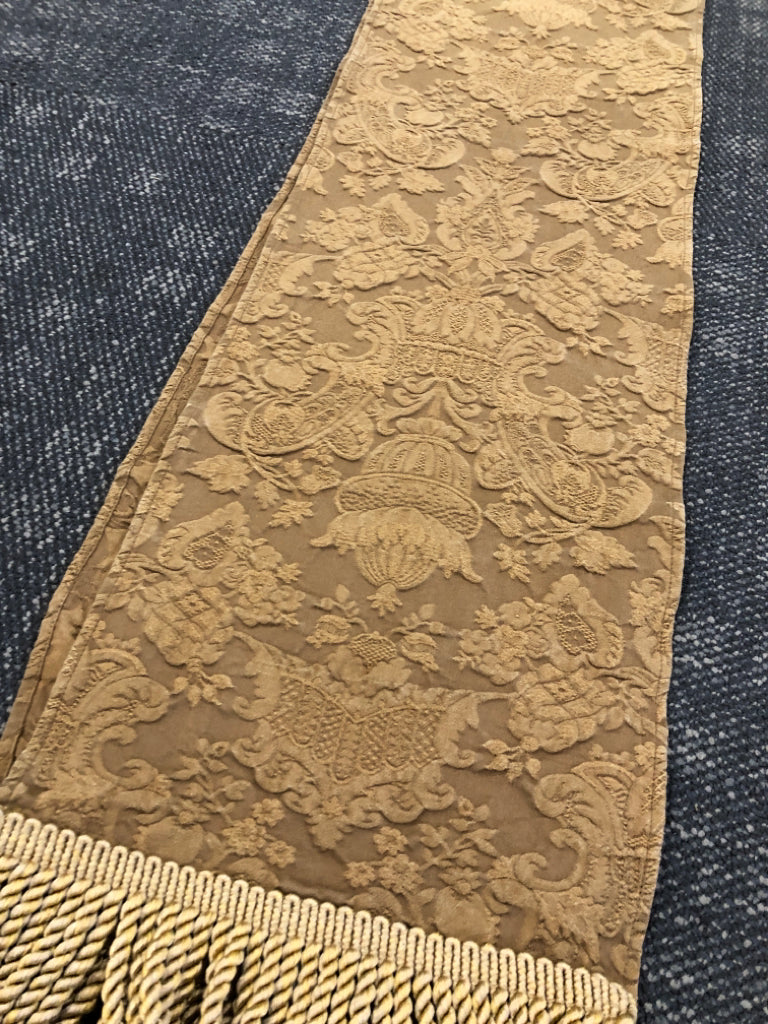 BROWN TABLE RUNNER W/DAMASK PATTERN+GOLD TASSELS.